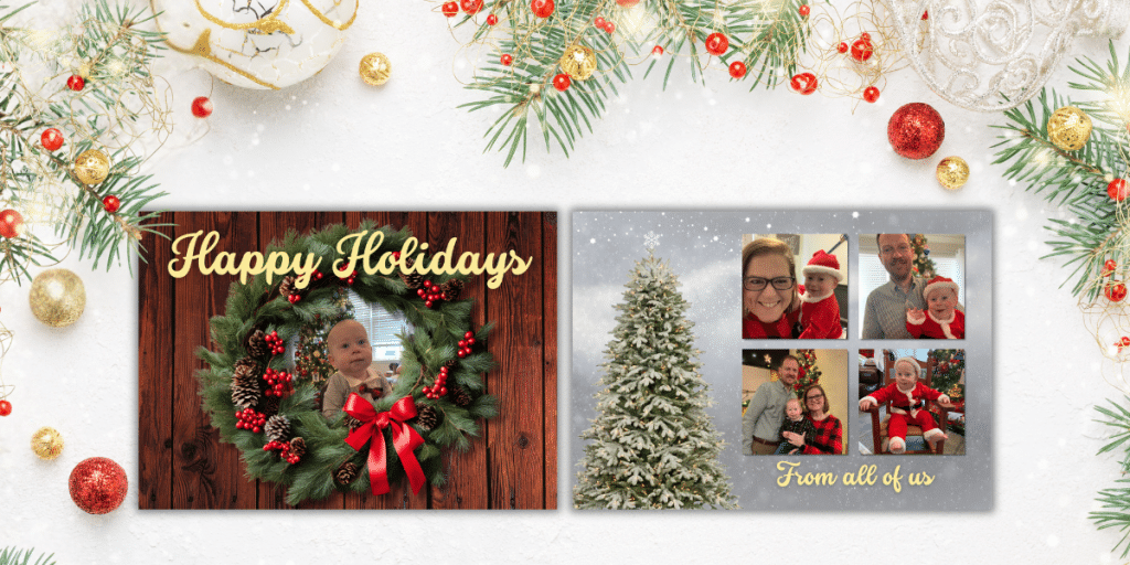 A double sided photo card with a wreath on one side and a Christmas tree on the other laying on a table covered in Christmas decorations