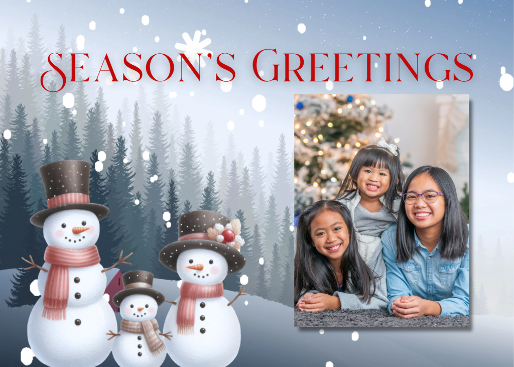 A Winter Photo Card that says season's greetings with a photo of 3 sisters laying in front of a Christmas tree. The card has a snowman family standing in front of pine trees as the snow falls.